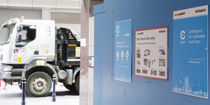 Construction site hoarding with health & safety signage