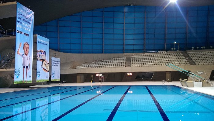 Branded hanging banners & event signage for SwimBritain Aquatic Centre by Octink