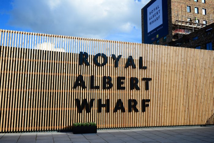 Exterior signage using fret cut lettering on a wooden hoarding